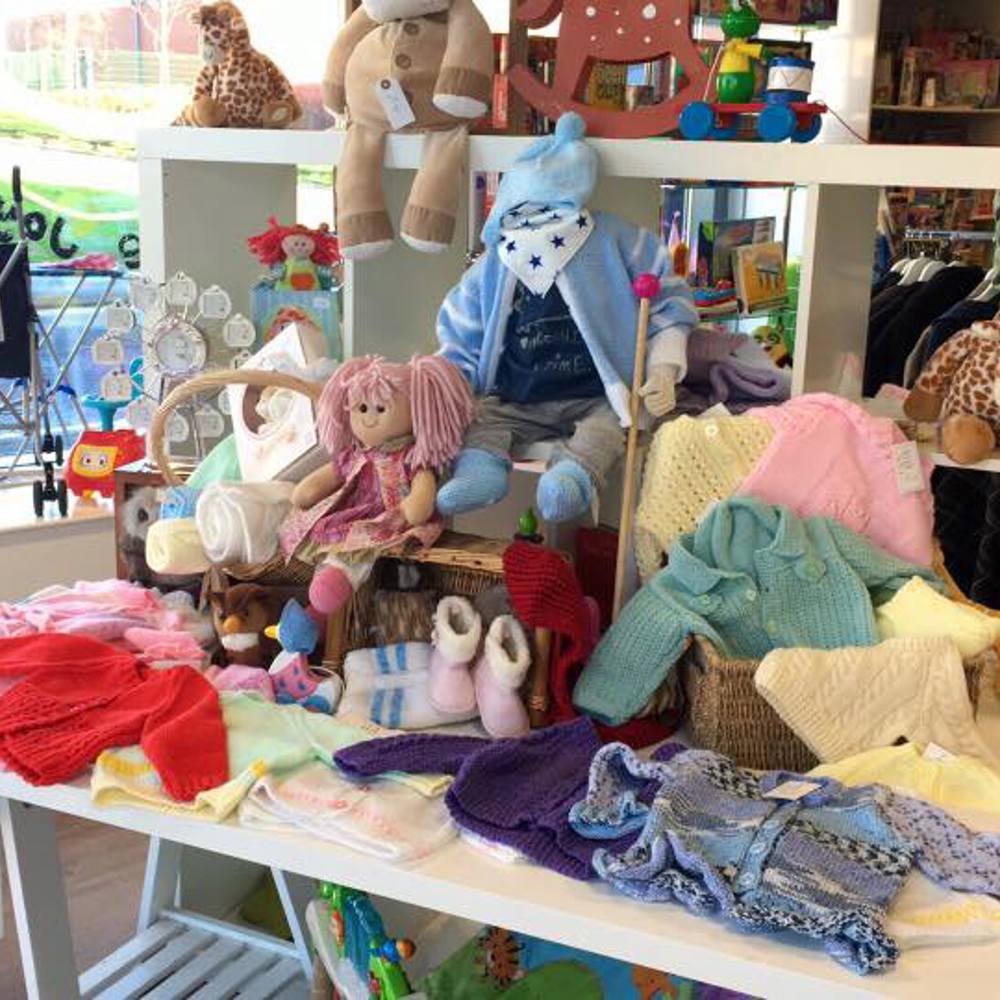 A shop interior showing a range of charity shop products attractively presented