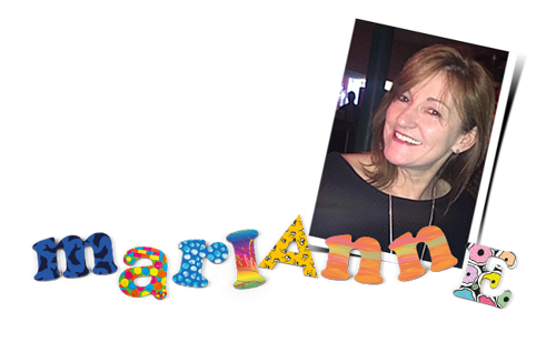 Marianne smiling in a portrait with her name spelt in CHAS alphabet letters.